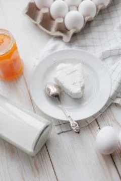 Cottage cheese with peach jam Stock Photos