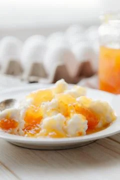 Cottage cheese with peach jam Stock Photos