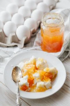 Cottage cheese with peach jam Stock Photos