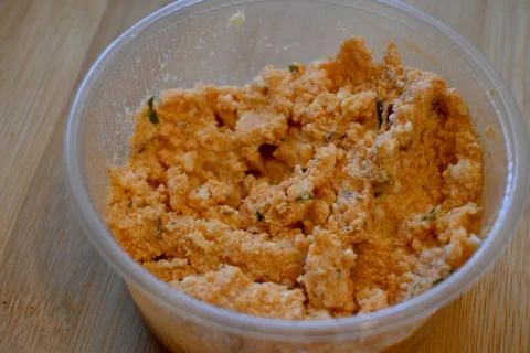 Cottage cheese in plastic container close-up Fotos Stock