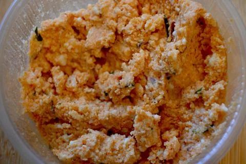 Cottage cheese in plastic container close-up Fotos de archivo