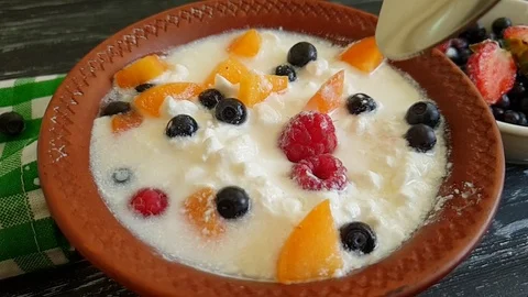 Cottage cheese raspberry blueberry slow-motion Stock Footage 91107467