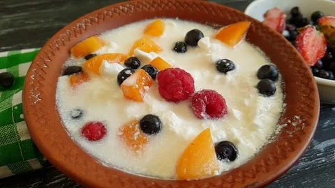 Cottage cheese raspberry blueberry slow-motion Stock Footage 91107482