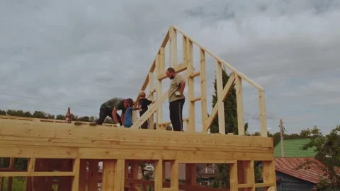 Cottage construction, builders, construction workers' work processes Stock Footage 339506577