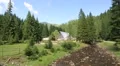 Cottage in forest near mountain river, Carpathians, Ukraine HD Footage