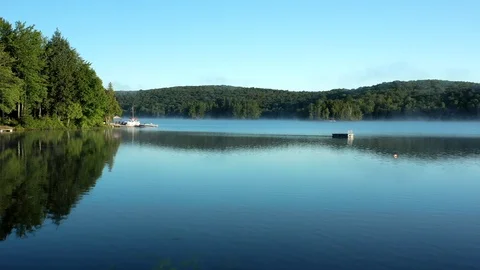 Cottage Lake Dock Fly-by Stock Footage 115799697