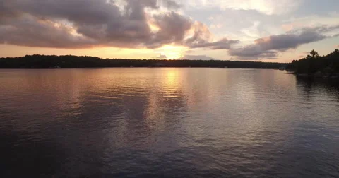 Cottage lake at sunset  Stockbeeldmateriaal 68893761