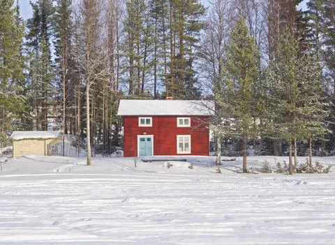 Cottage in snow Stock Photos