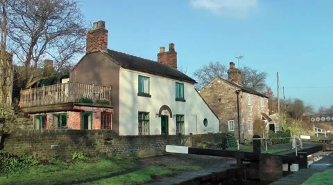 Cottages and lock on canal Stock Footage 46467718