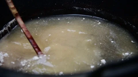 Cotton being dyed manually in process of making Indonesian Batik Stock Footage 71238965