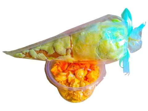 Cotton candy and pop corn in a transparent plastic container Foto stock