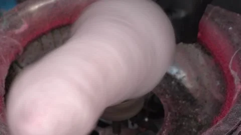 Cotton candy forming on stick in machine Stock Footage 313673802