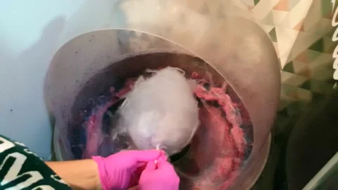 Cotton candy that is prepared in a machine Stock Footage 140381715