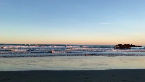 A cotton-candy sky melting into the ocean Stock Footage 341876497