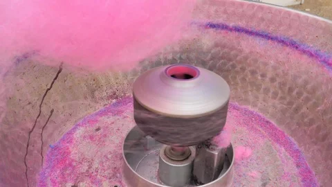 Cotton machine working and hand filling blue sugar Stock Footage 124379024