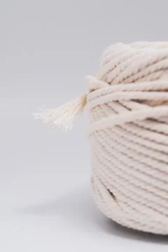 Cotton ropes are material for macrame weaving. Over the white background surf Stock Photos