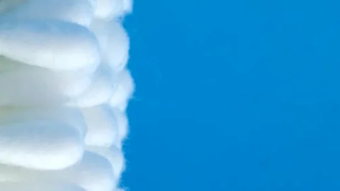 Cotton swabs on a dark background. Close up. Vertical video Video stock 250028385