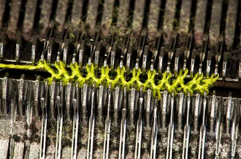 Cotton thread on knitting machine Stock Photos