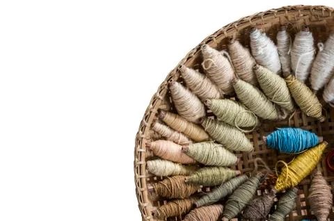 Cotton thread rolls in the threshing basket isolated on white background Stock Photos