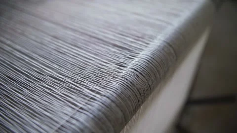 Cotton threads on traditional weaving loom for organic textile production. Stock Footage 144660216
