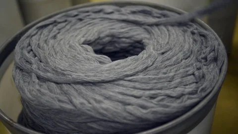Cotton yarn drawn from storage in textile industry. Stock Footage 72600544