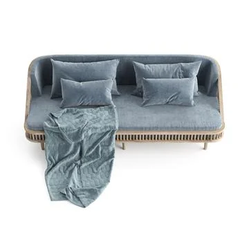 A couch that has pillows on it with a blanket nearby Ilustração Stock
