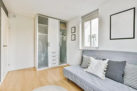 Couch in room with closet Stock Photos