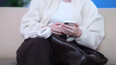 Couch scene shows person using phone Stock Footage 345672857
