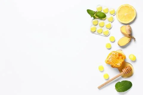 Cough drops in blister with ginger root, lemon slice, mint leaves and honeyco Stock Photos