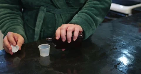 Cough Syrup Being Poured Stock Footage 299619862