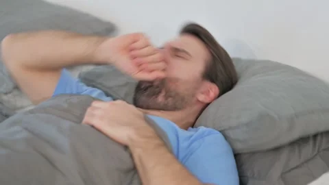 Coughing Sick Middle Aged Man while Sleeping in Bed Stock Footage 297445357