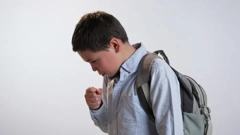 Coughing student boy with a backpack 스톡 동영상 239624842
