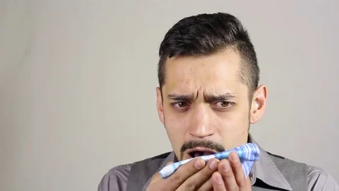 Coughing young bearded man Stock Footage 73686301