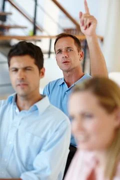 Could you repeat that statement please. Shot of workers sitting in the office Stock Photos
