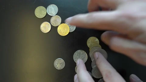Count coins on a black surface Stock Footage 147475888