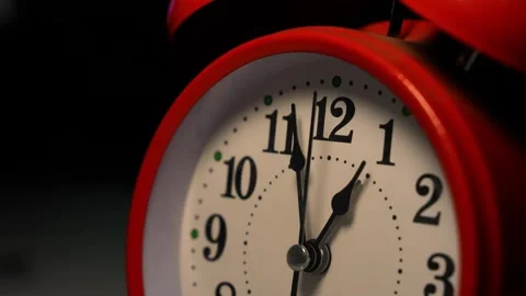 Count down Close-up of a red alarm clock showing the time just before midnigh Stock Footage 321936986
