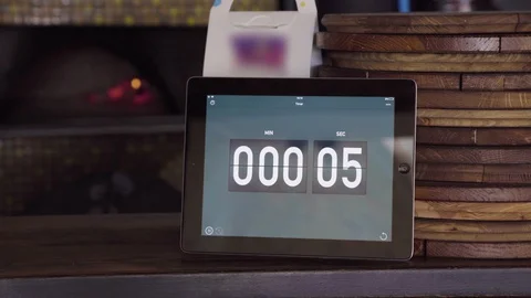 Count down on the screen in the pizzeria. Pizza boards and owen Stock Footage 129419630