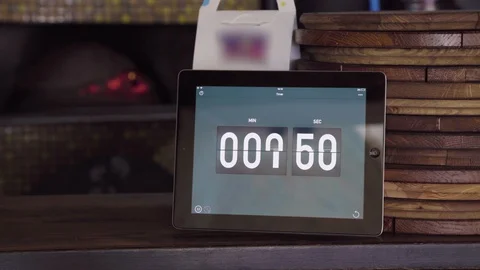 Count down on the screen in the pizzeria. Pizza boards and owen Stock Footage 129419644