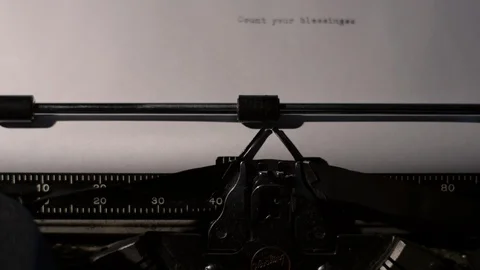 Count Your Blessings typed out on a vintage typewriter Stock Footage 97763000