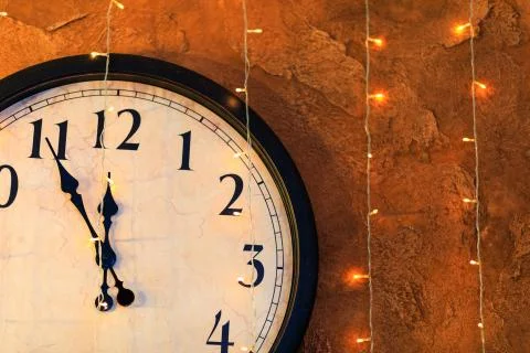 Countdown to midnight. Retro style clock counting last moments before Christm Stock Photos