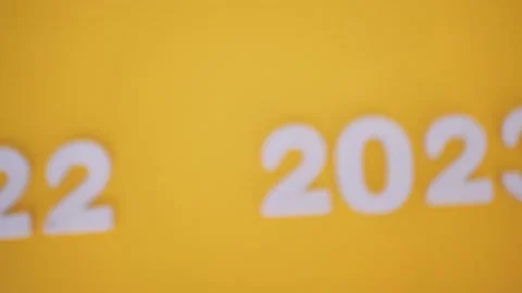 Countdown to the new year 2022-2023 on a yellow background Stock Footage 211408095