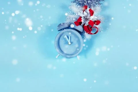 Countdown time on alarm clock and vivid bokeh on blue background Stock Photos