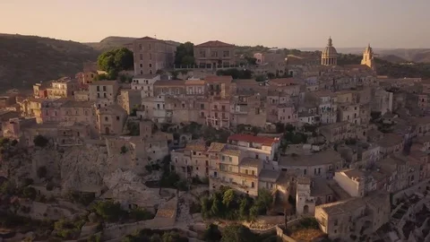 Counter clockwise circling south side of Ragusa Ibla at sunset Stock Footage 77458631