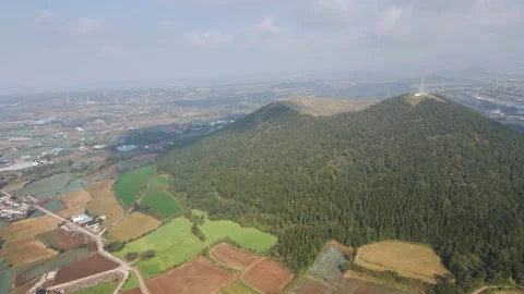 Counter-clockwise Dolly-in Aerial View of Geum Oreum, Jeju, South Korea. Video stock 146066715