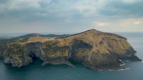Counter-clockwise View of S/W Cliffs of Soemeori Oreum, Udo Island, Jeju. Stock Footage 146067449