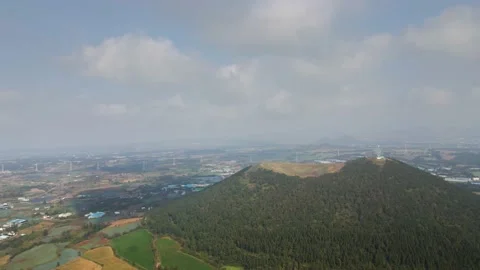 Counter-clockwise Wide Aerial View of Geum Oreum, Jeju, South Korea. Stock Footage 146066699