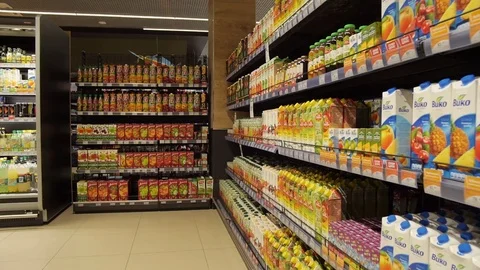Counter with different types of juice, camera moves from right to left Stock Footage 75256252
