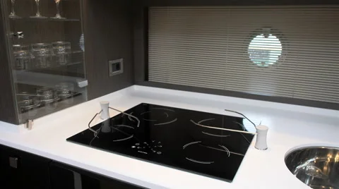 Counter of fancy white kitchen on lower deck of a boat Stock Footage 62573837