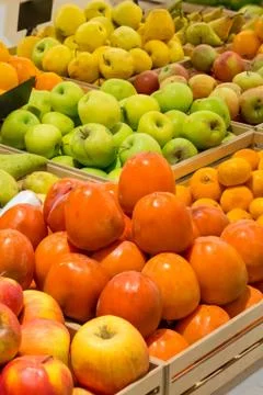 Counter with fruit persimmon Stock Photos