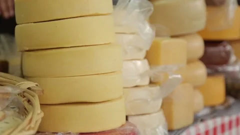 Counter with a large selection of cheeses in Kotor. Cheese market in Monteneg Stock Footage 110251221
